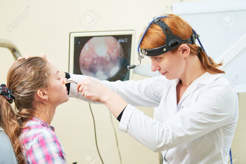 ENT doctor examining a patient